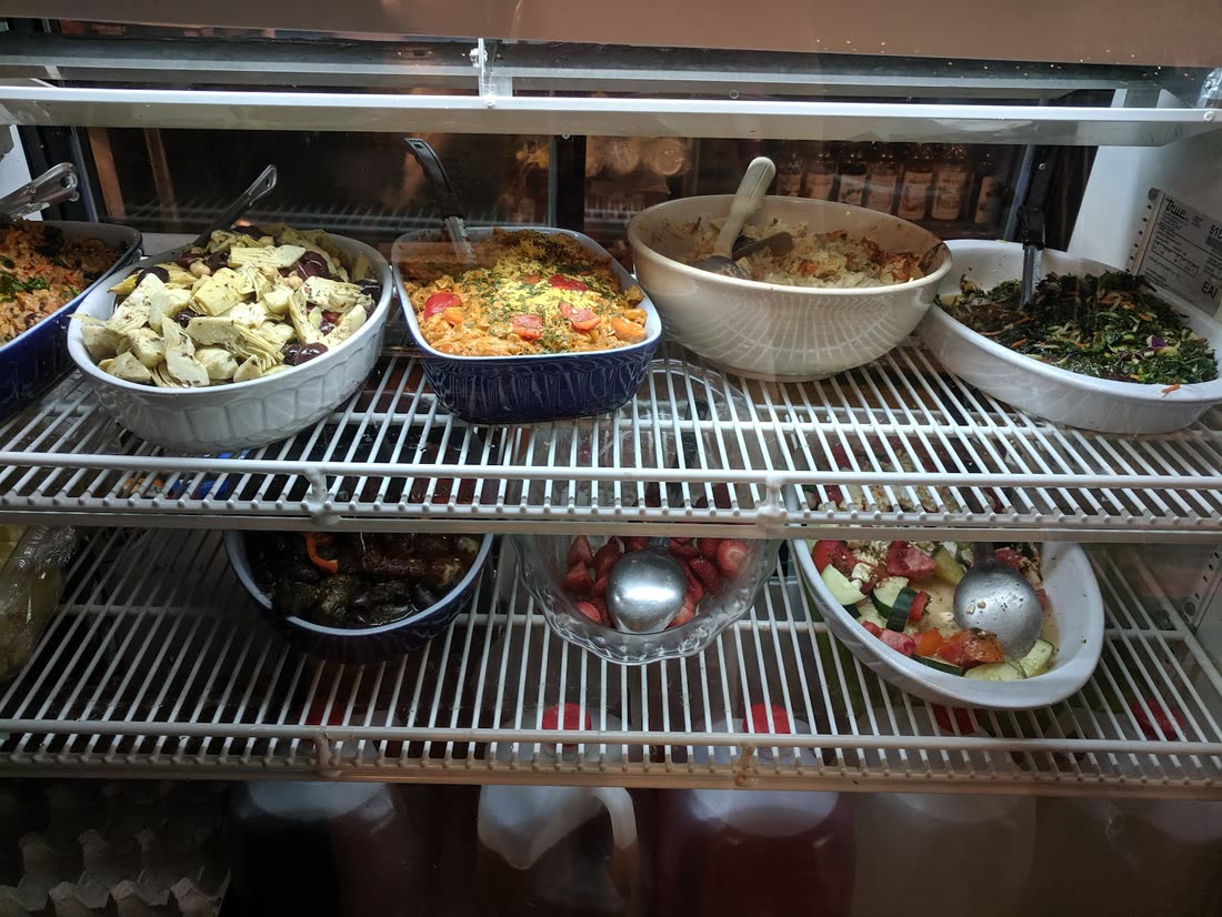 The glass deli case at Gardner's Market filled with house-made salads and sides